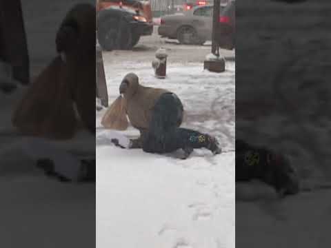 Man Falls on Snowy Sidewalks #shorts