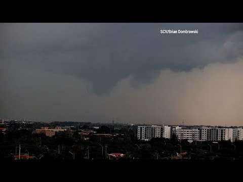 Funnel Clouds Over Miami, FL As Commercial Airplanes Take Off And Land